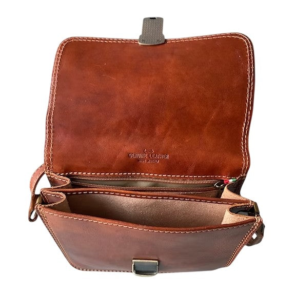 Open brown leather bag with multiple compartments and stitching.