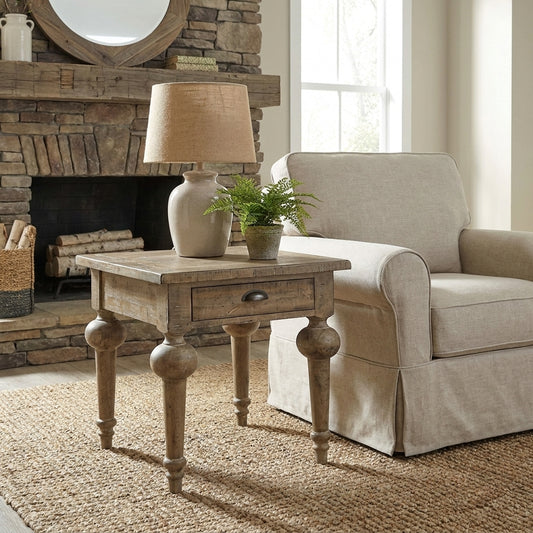 Wooden side table with a drawer and ornate turned legs.