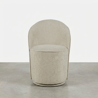 Beige curved chair with soft, round design.
