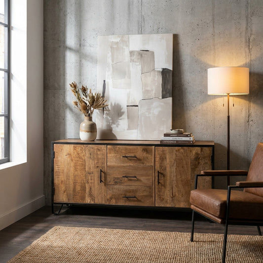 Cozy modern room with wood cabinet, art, and a warm floor lamp.