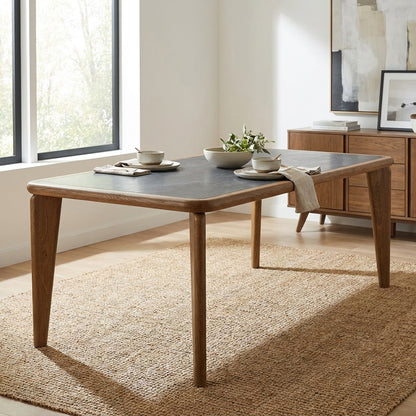 Rectangular wooden table with sleek legs.
