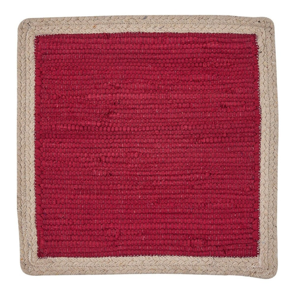 Square red woven mat with a beige border.