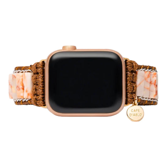Smartwatch with a bohemian, stone-adorned band.