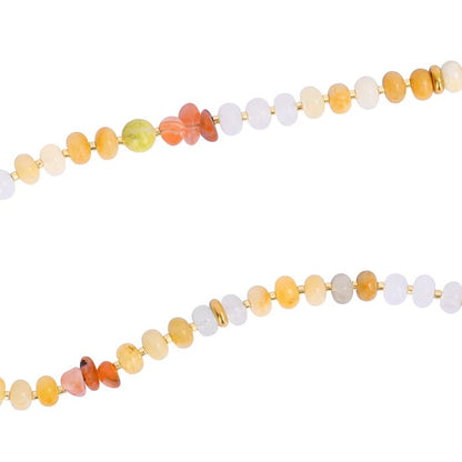 Colorful gemstone bead necklace with gold accents on a white background.