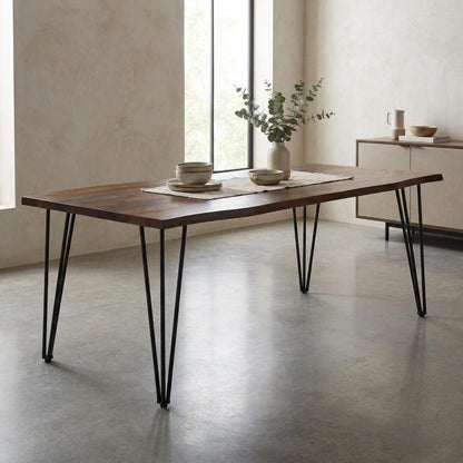 Wooden table with metal legs, vase, and bowls in a minimalist room.