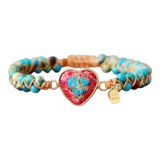 Turquoise bead bracelet with a red heart centerpiece.