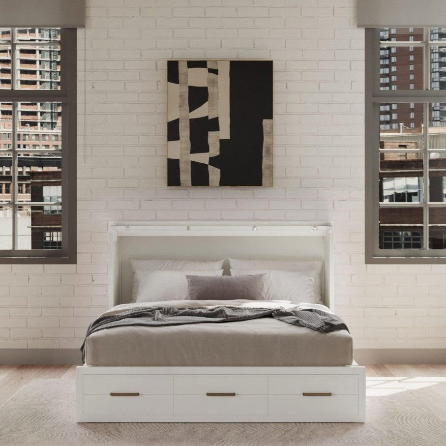 Modern bedroom with a white bed and abstract wall art.