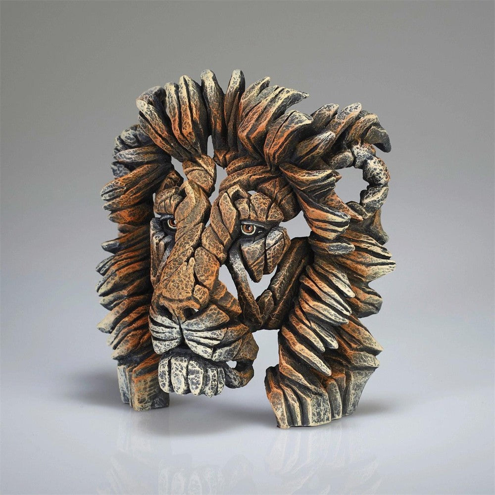 Lion sculpture made of textured, interlocking stone-like pieces.