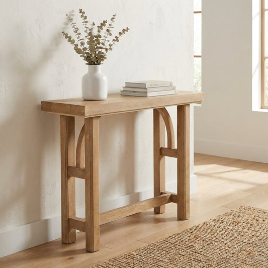 Simple wooden console table with arch details.