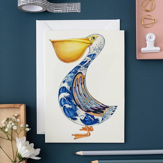 Colorful duck card with wave pattern design on a desk.