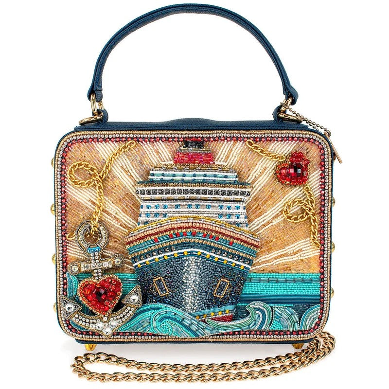 Beaded handbag with ship design, anchor, hearts, and sunburst pattern.