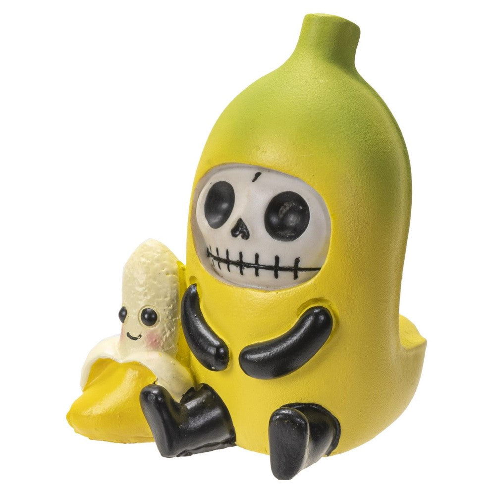 Skeleton in banana costume with a smiling banana figurine.