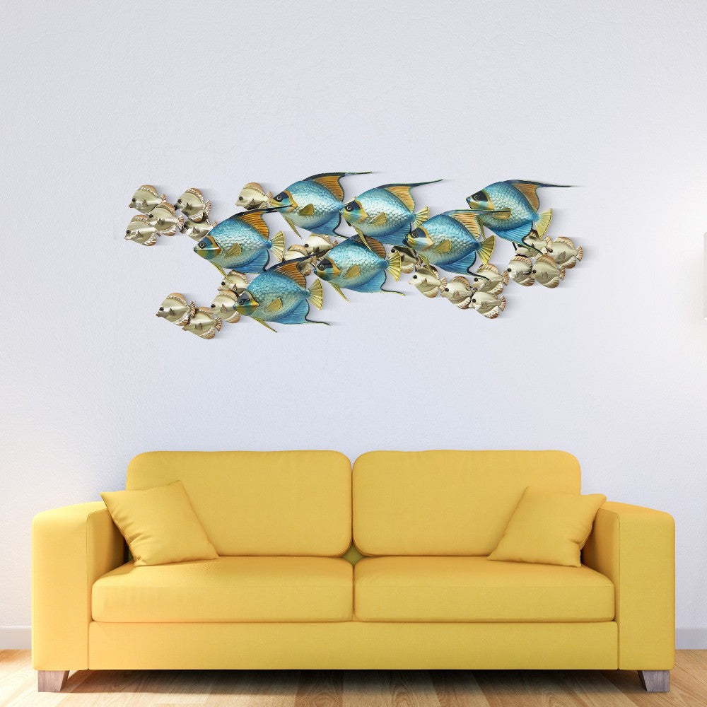 Yellow sofa with fish wall art above.