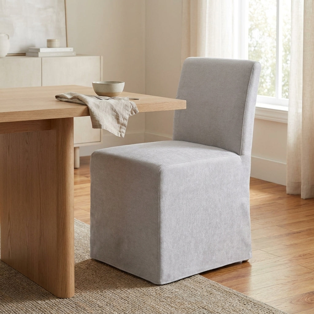 Simple grey upholstered chair, minimalist design.