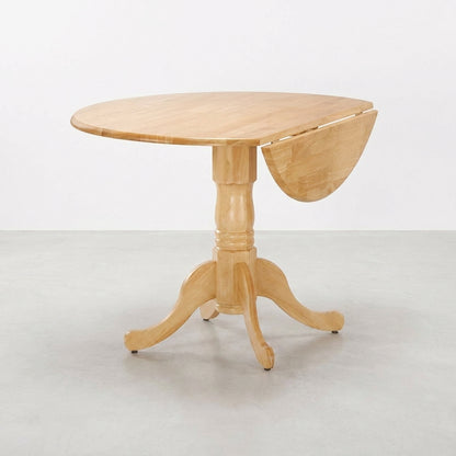 A wooden drop-leaf table on a light gray floor.