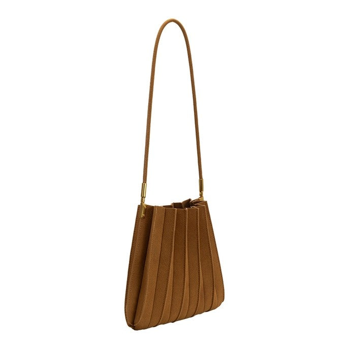 Brown pleated handbag with a long strap.