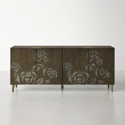 Dark wooden sideboard with floral carvings and metallic legs.