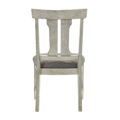 Gray wooden chair with a cushioned seat, viewed from the back.