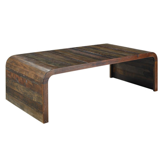 Modern, low wooden table with rounded corners and a rustic finish.