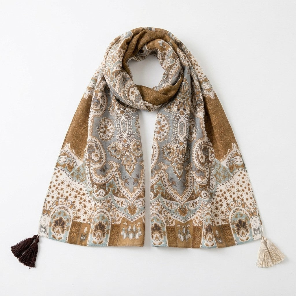 Elegant scarf with intricate patterns and tassels, in earthy tones.