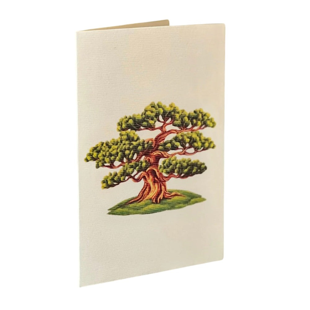 Greeting card with a green tree illustration on the cover.