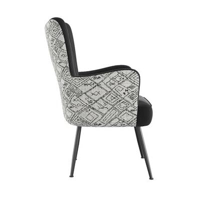 Side view of a patterned, mid-century modern chair with slim legs.