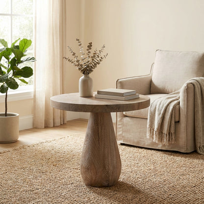 Round wooden table with a conical base.