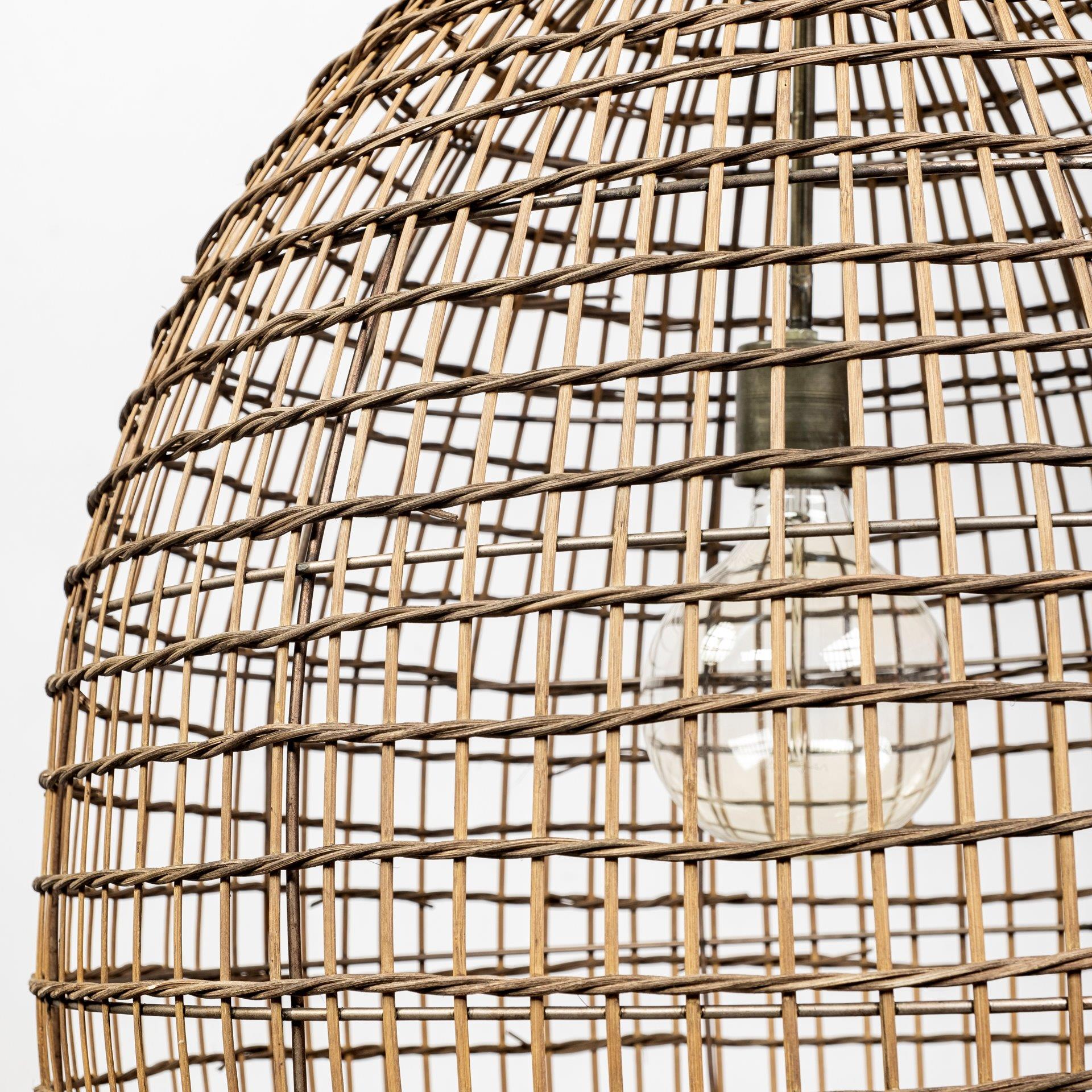 Woven wicker lampshade encasing a light bulb.