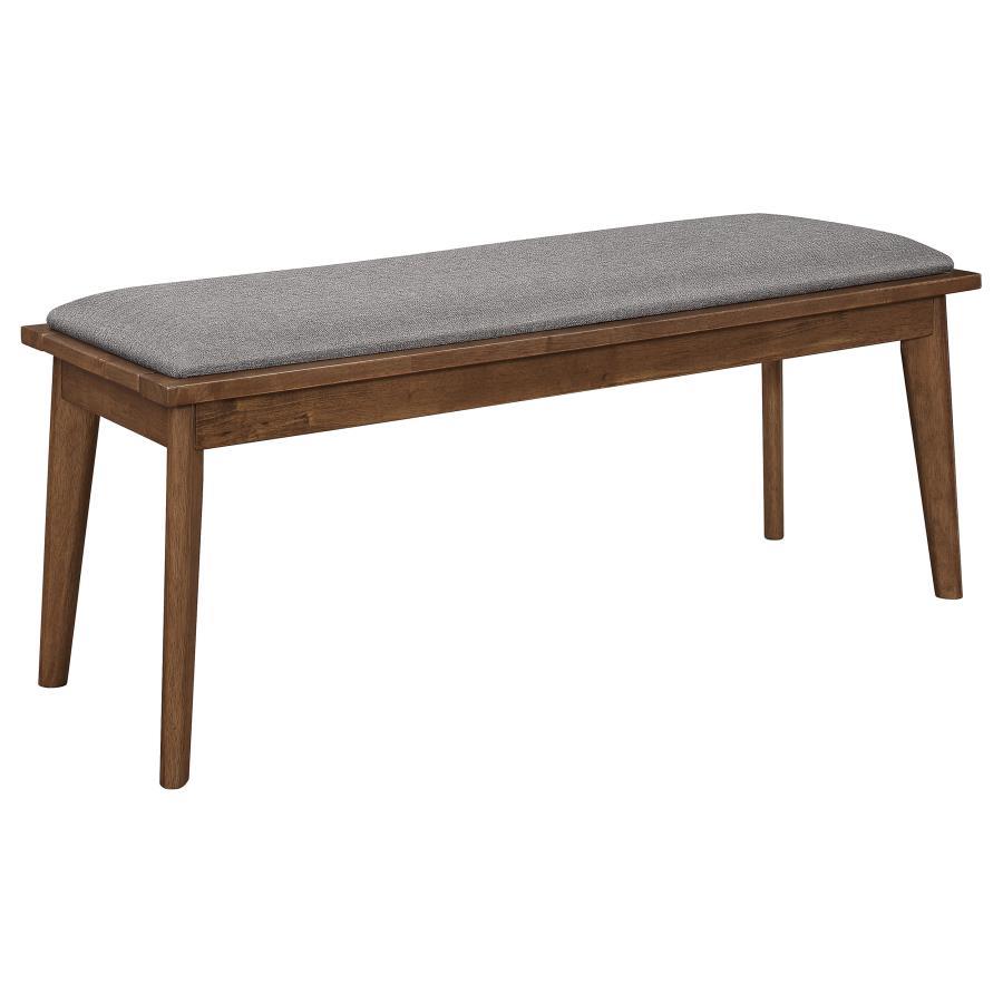 Wooden bench with a gray cushioned seat.