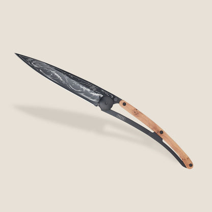 Elegant wooden-handled knife with intricate blade design.