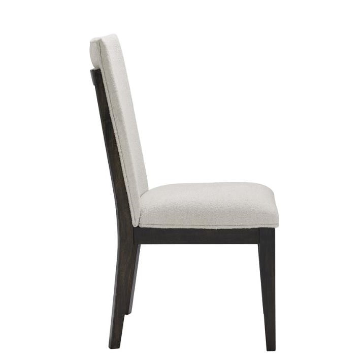 Side view of a chair with black frame and white cushioned seat and backrest.