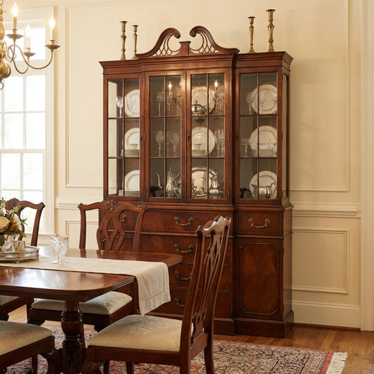 Elegant dining room with a vintage china cabinet and wooden table.
