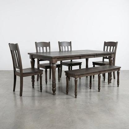 Wooden dining table set with four chairs and a bench.