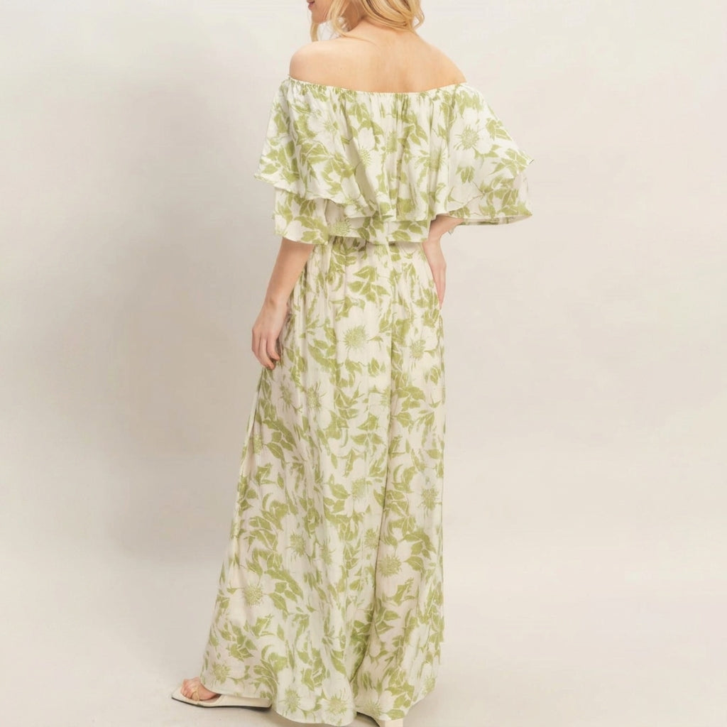 Woman in off-shoulder floral maxi dress, back view.