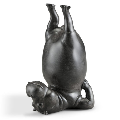 Sculpture of an upside-down hippo.