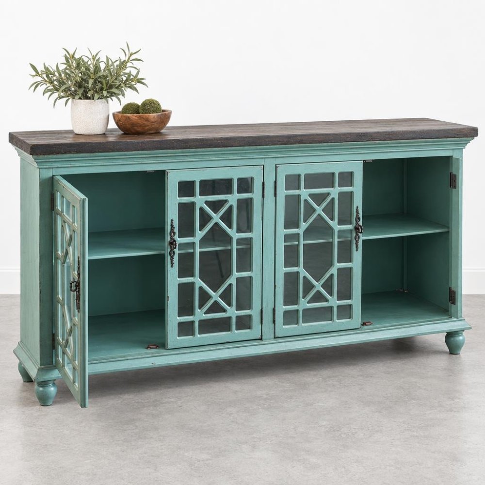 Vintage teal cabinet with glass doors, decor items on top.