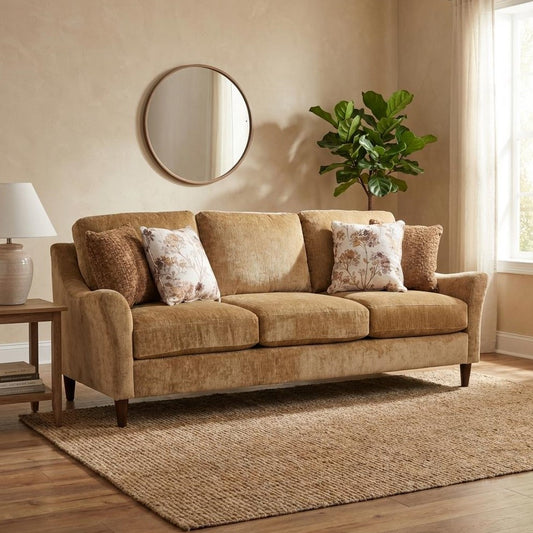 Cozy living room with a beige sofa, mirror, and green plant.