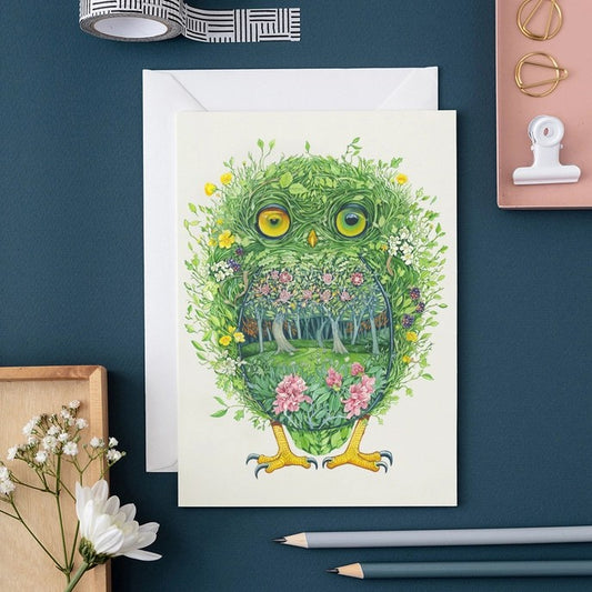Artistic owl card with floral and forest design.