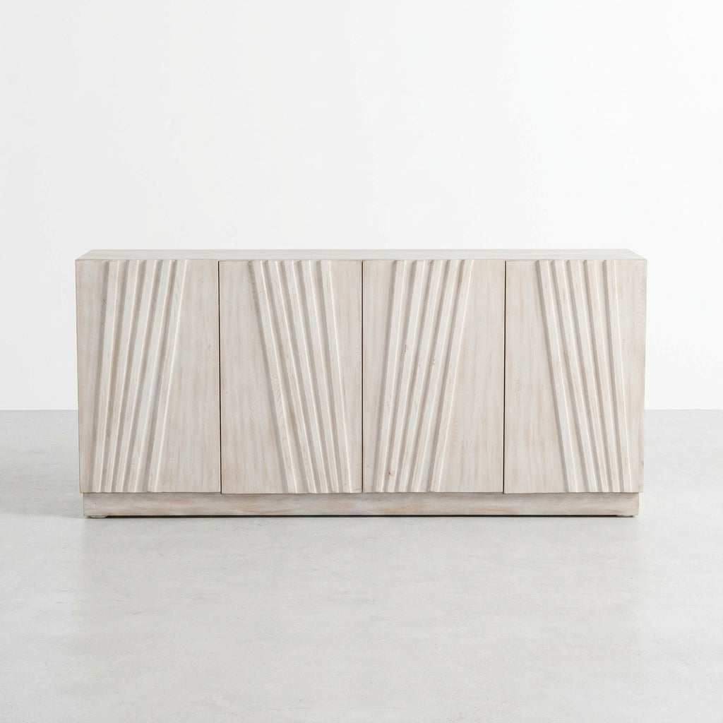 Modern wooden sideboard with angled grooves in a minimalist setting.