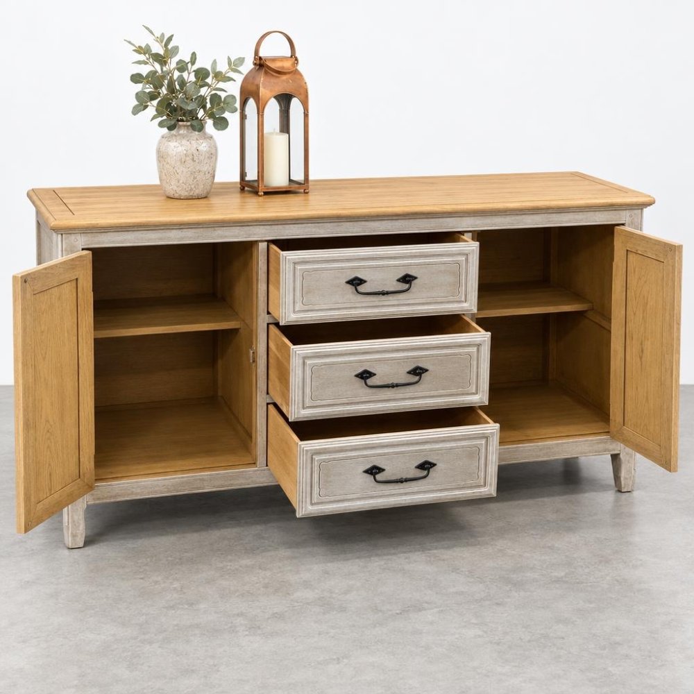 Wooden sideboard with open drawers, plant, and lantern on top.