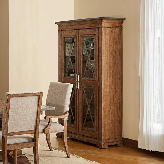 Dining room with wooden cabinet and upholstered chairs.