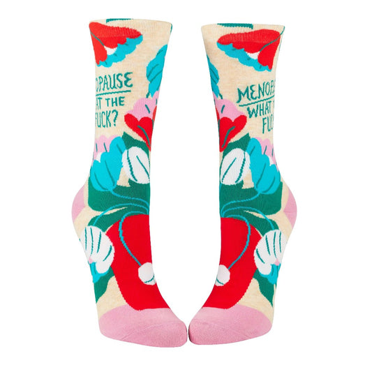 Colorful socks with floral design and bold text.