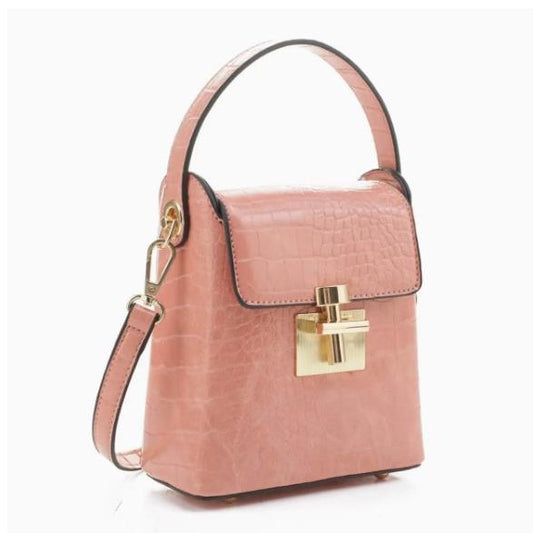 Pink textured handbag with a gold lock and detachable strap.