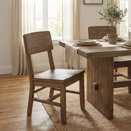 Wooden chair with a simple, rustic design.