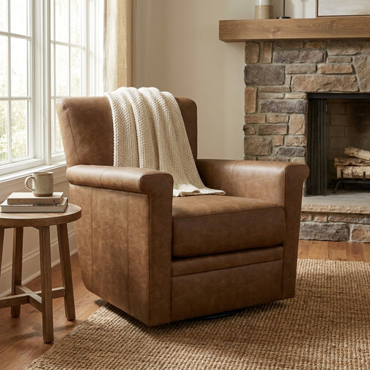 Cozy room with armchair, throw, books, and mug by a stone fireplace.