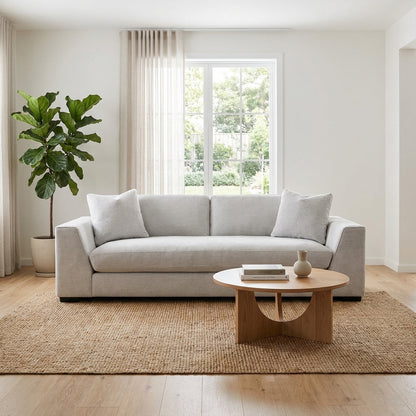 Gray modern sofa with plush cushions.