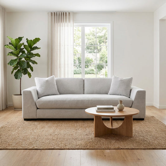 Gray modern sofa with plush cushions.