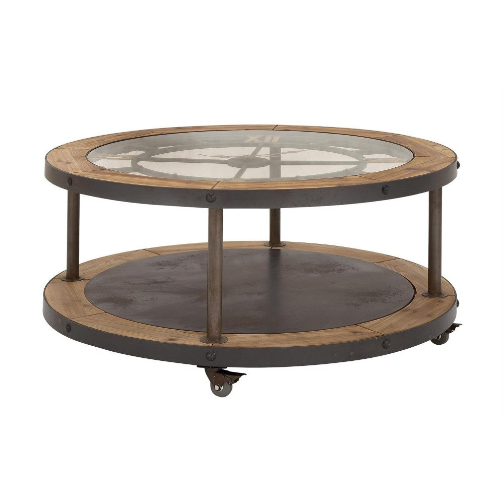 Round industrial coffee table with glass top and wooden accents on wheels.