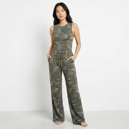 Woman in camo lounge set posing against a white background.