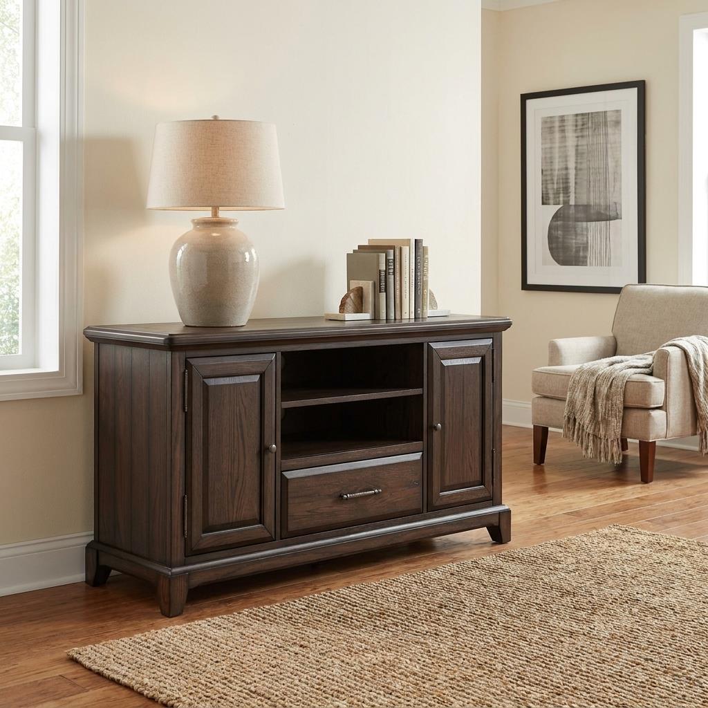 Cozy living room with a dark wood console and beige armchair.